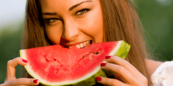 A girl eats watermelon for weight loss